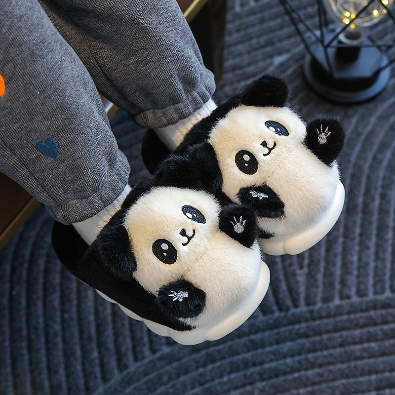 Panda-themed slippers worn indoors on a carpeted floor.