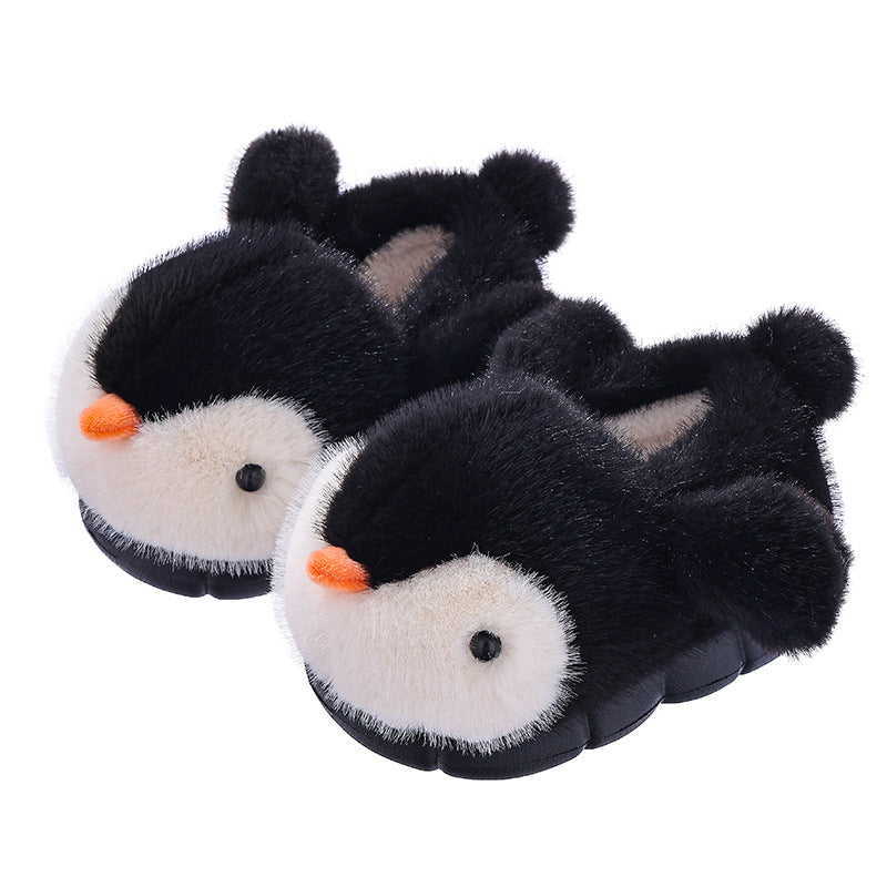 Pair of black penguin slippers on a white background