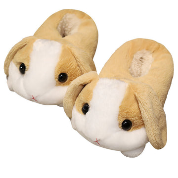 Pair of plush rabbit slippers on a white background