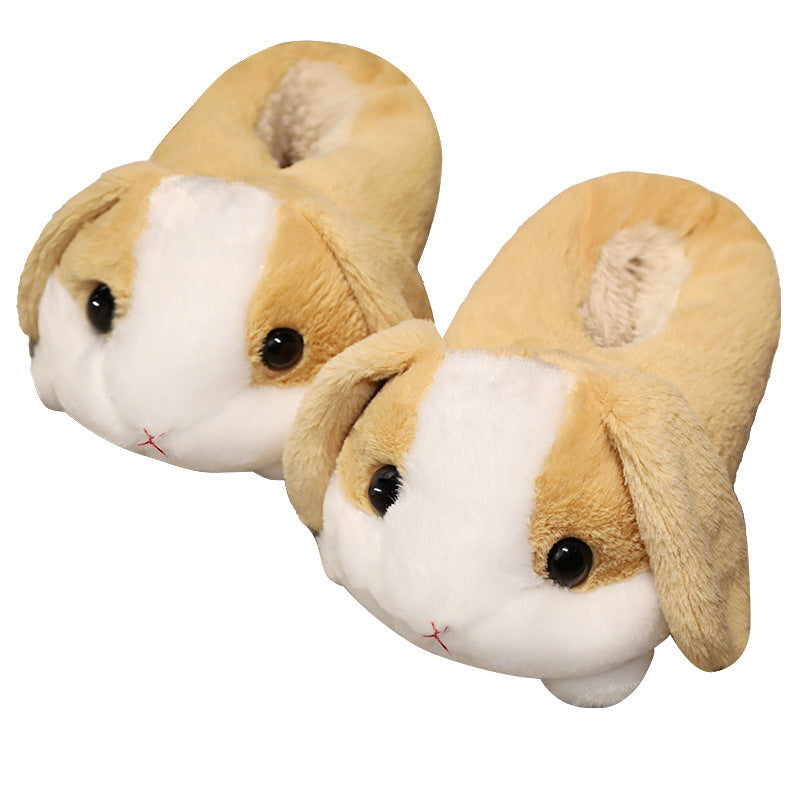 Pair of plush rabbit slippers on a white background