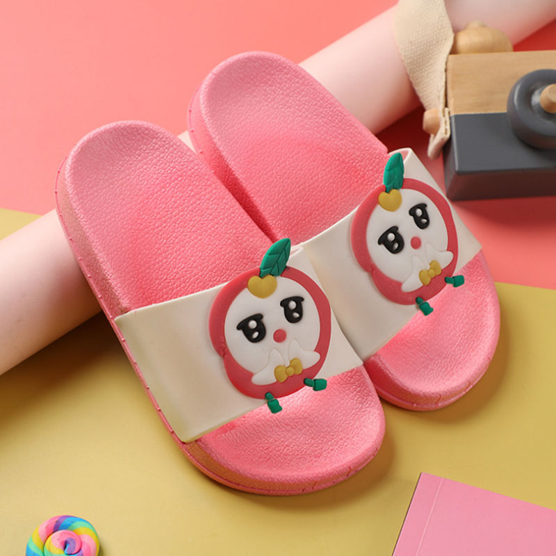 Pink children's slippers with cartoon character design on a colorful background