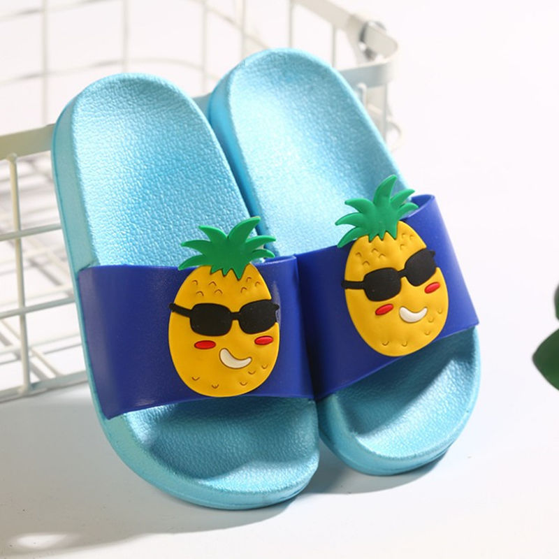 Blue slides with pineapple design on a white background