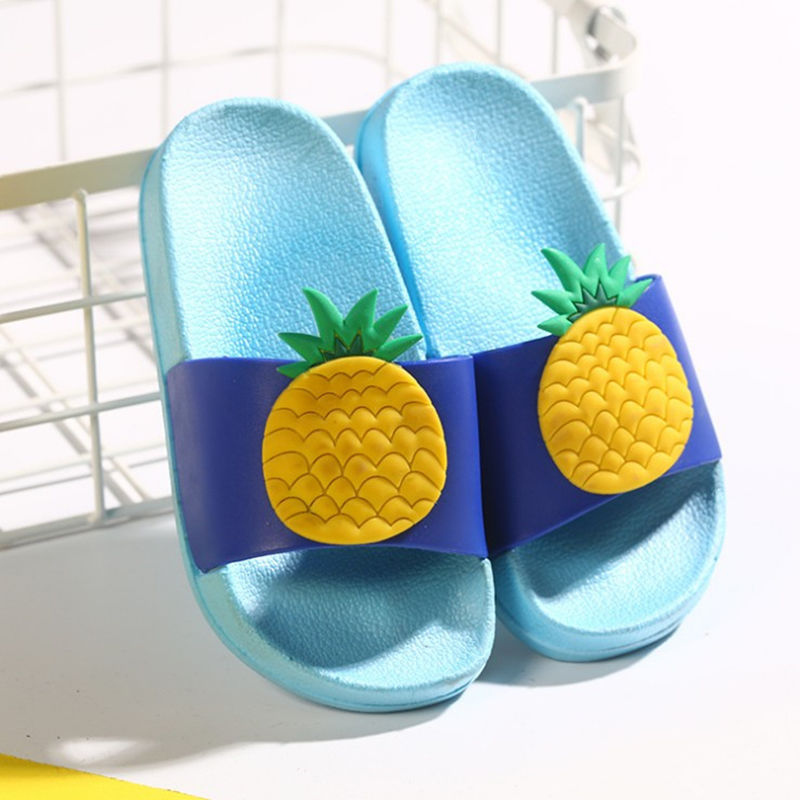 Blue slides with pineapple design on a white background