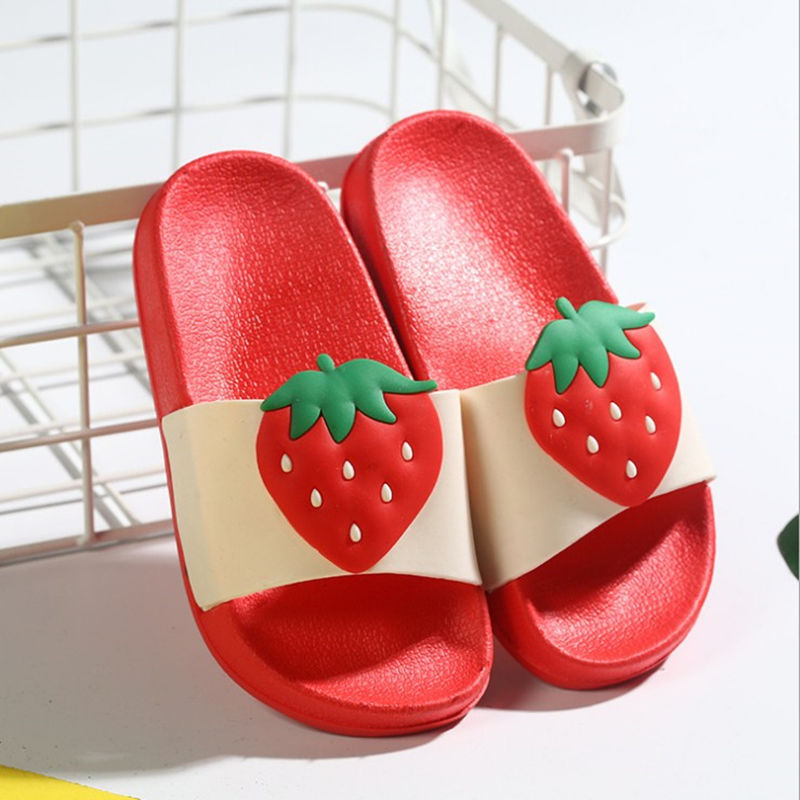 Red slide sandals with strawberry design on a white background