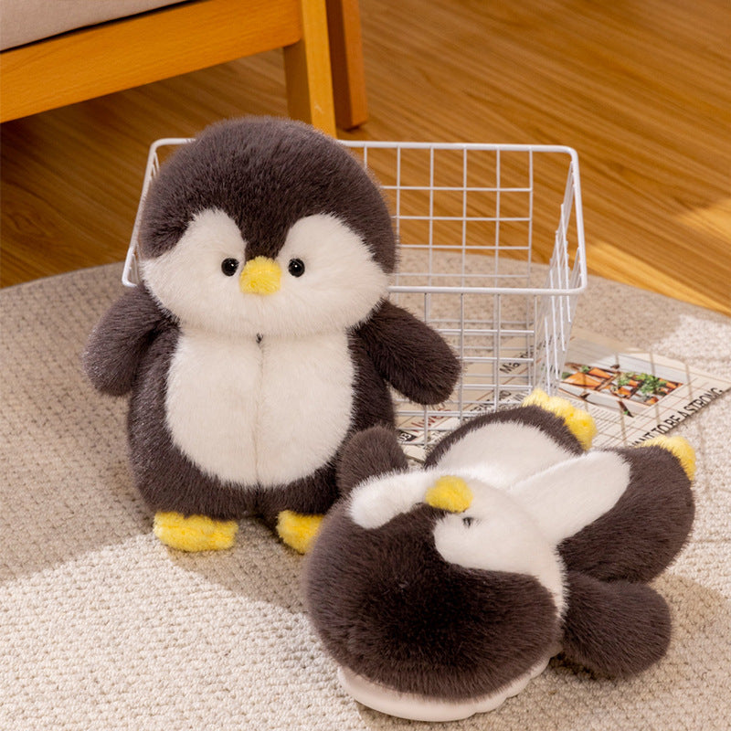 plush penguin slippers on a carpeted floor with a basket in the background.