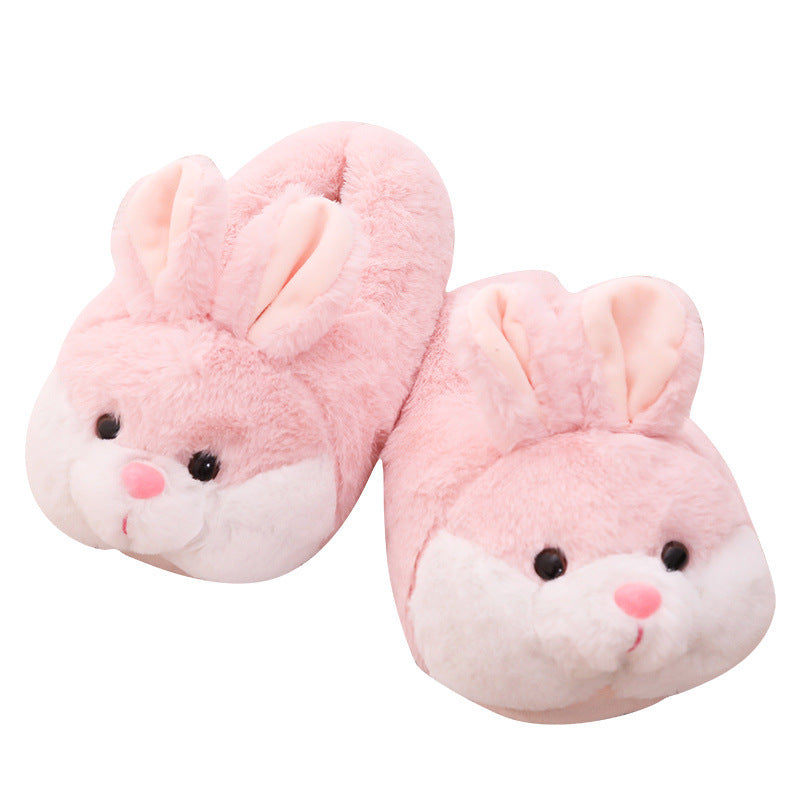 Pair of pink bunny slippers on a white background