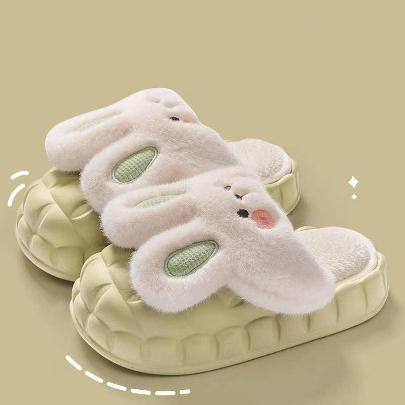 Pair of bunny-shaped slippers on a beige background