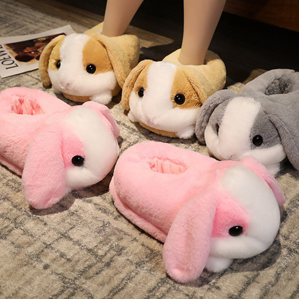 Plush different colors rabbit slippers  on a carpeted floor.