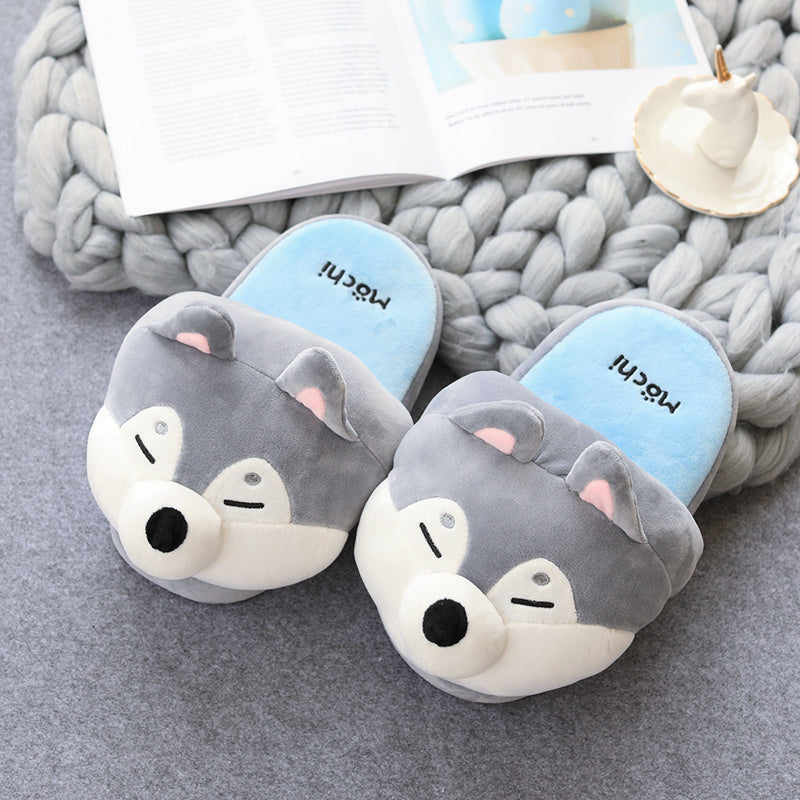 Pair of Novelty slippers on a textured surface