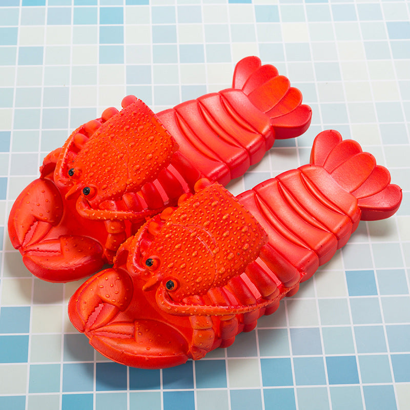 Red lobster-shaped slippers on a tiled surface