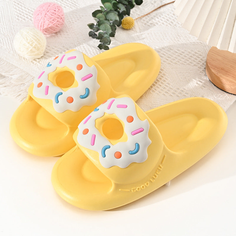 Yellow slippers with donut design on a light background