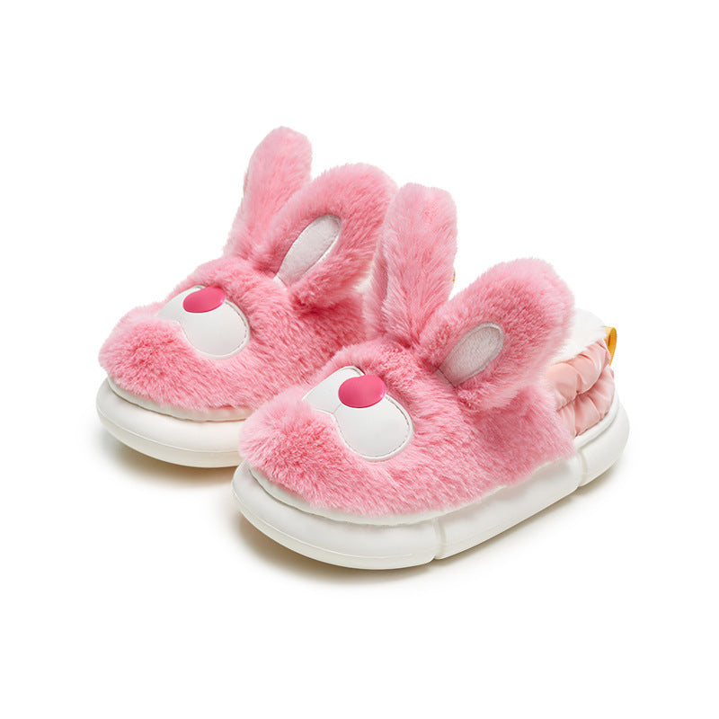 Pink bunny slippers with white soles on a white background