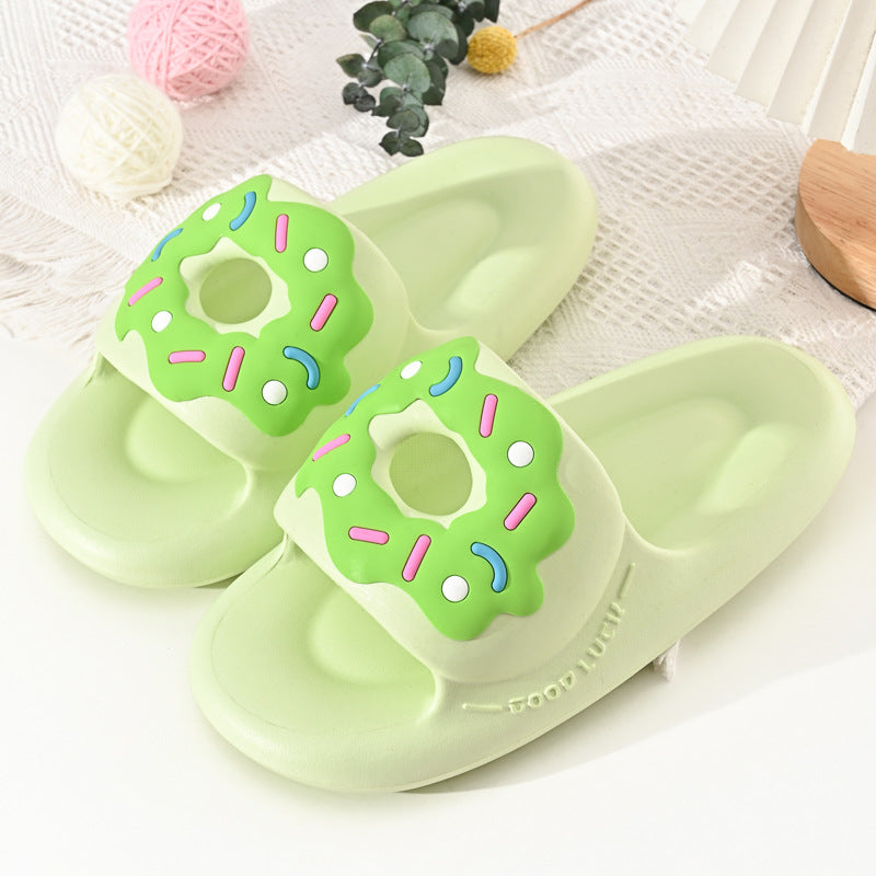 Green sliders with donut design on a white surface