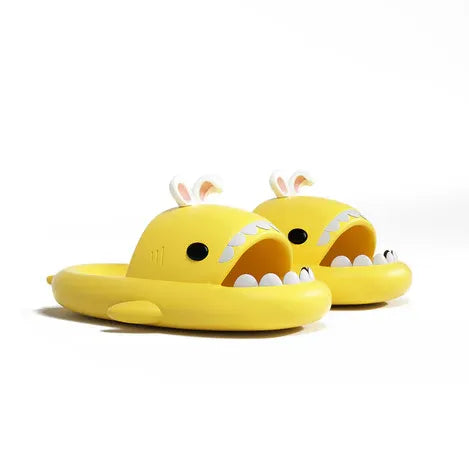 Yellow shark-themed children's sandals on a white background