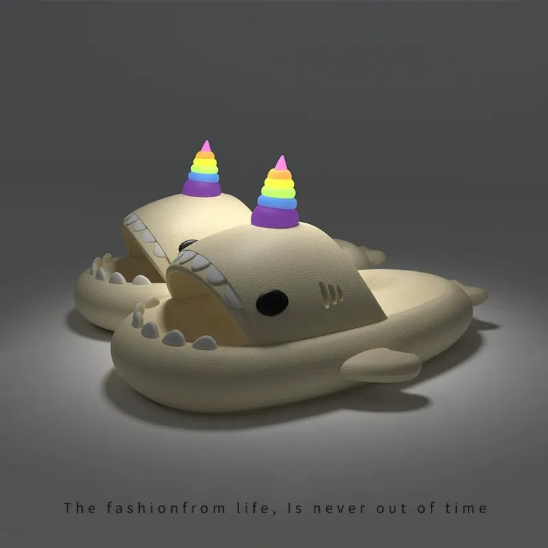 Toy shark with rainbow hats on a dark background