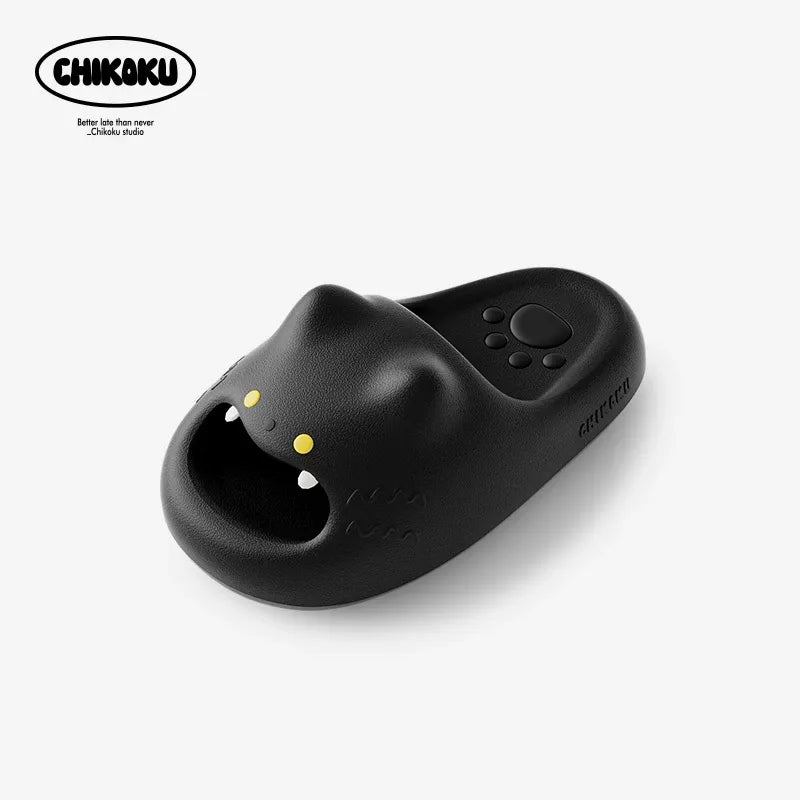Black cat-shaped slipper with yellow accents on a white background, featuring the Chikoku brand.