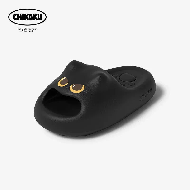 Black cat-shaped slipper with gold accents on a white background, featuring the Chikoku brand.
