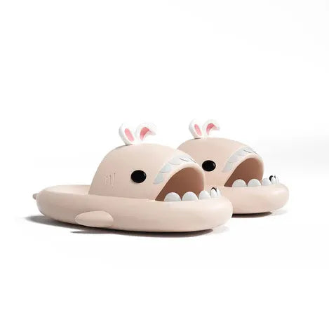 Beige shark-shaped sandals with bunny ears on a white background