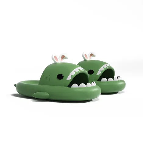 Green shark-shaped slides with bunny ears on a white background