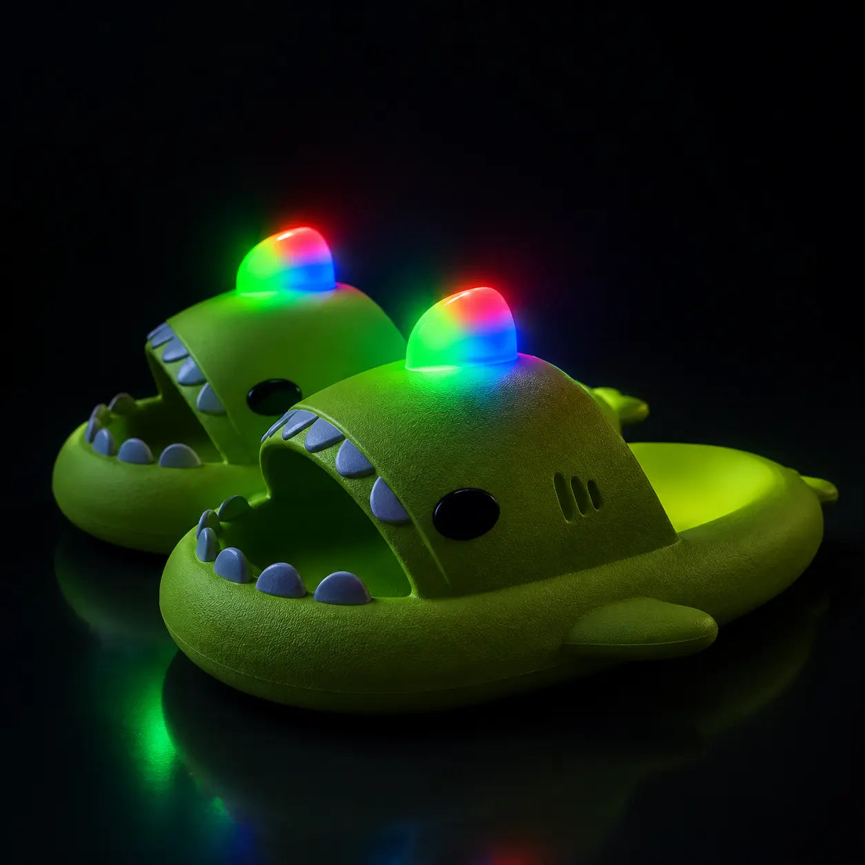 Green dinosaur-shaped slippers with colorful LED lights on a black background