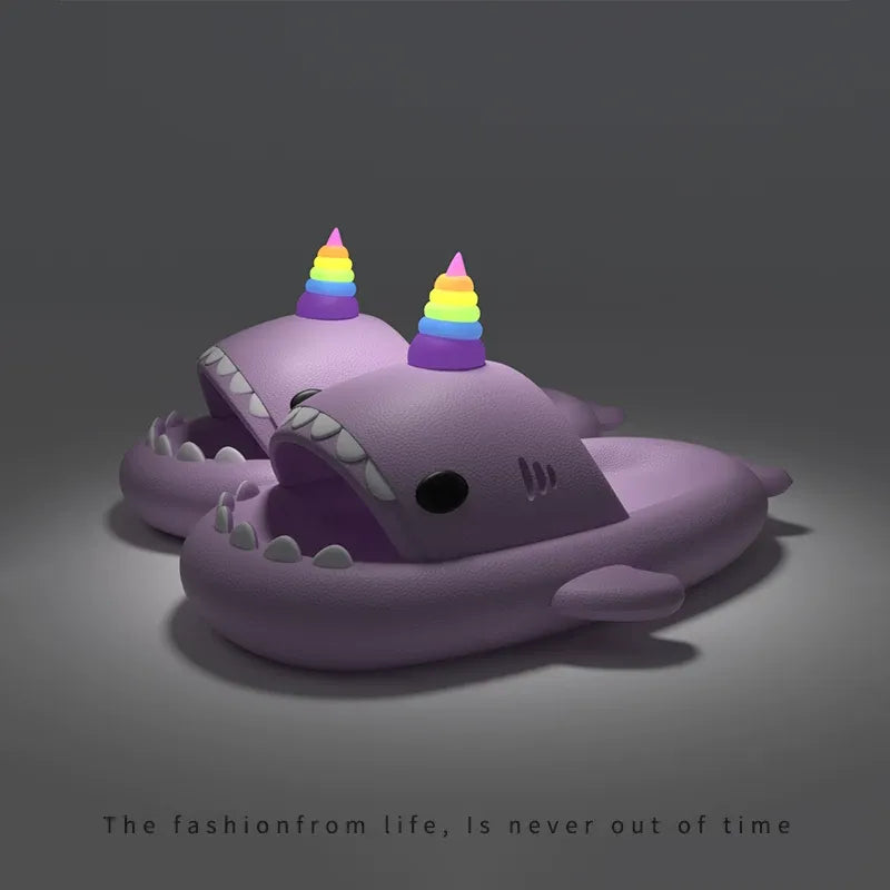 Purple shark slippers with rainbow hats on a dark background