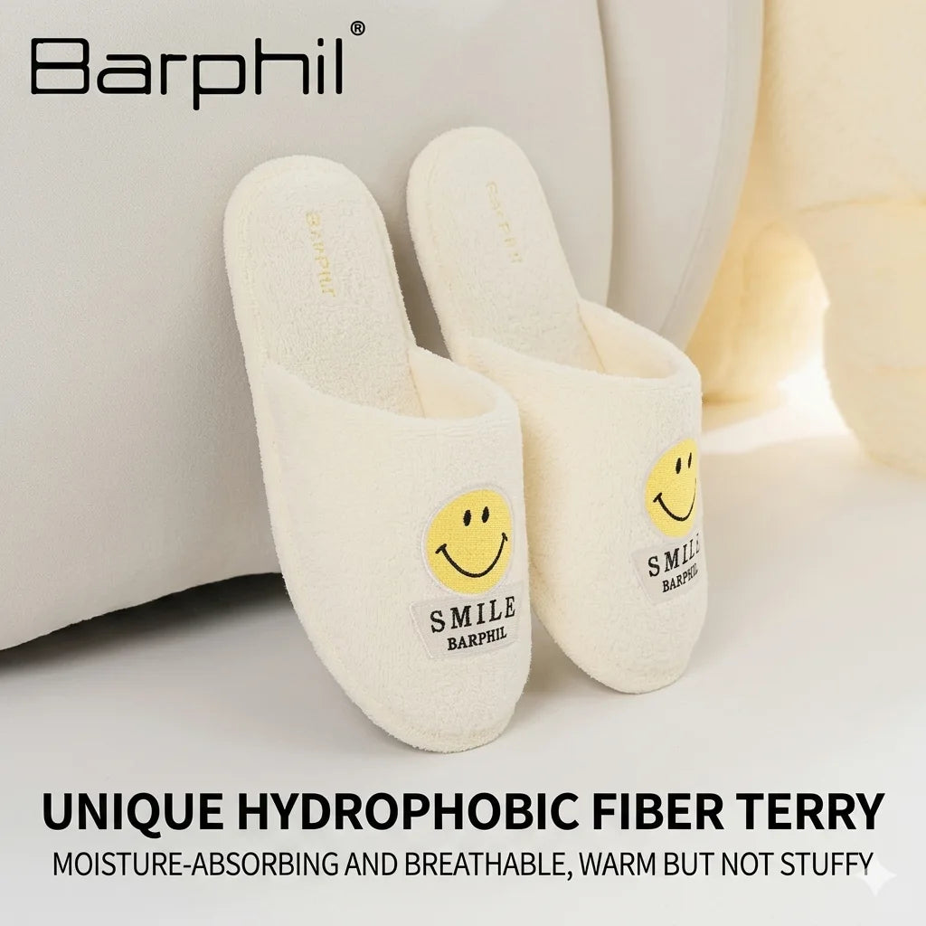 White slippers with smiley face design on a light background, featuring the Barphil brand.