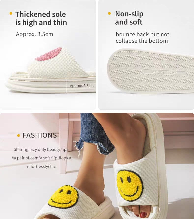 White slippers with smiley face design on a white background