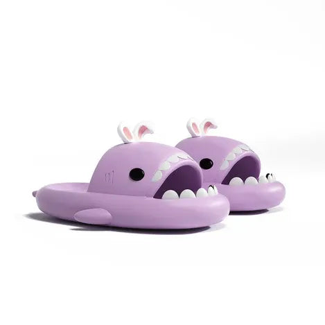 Purple shark-shaped slides with bunny ears on a white background