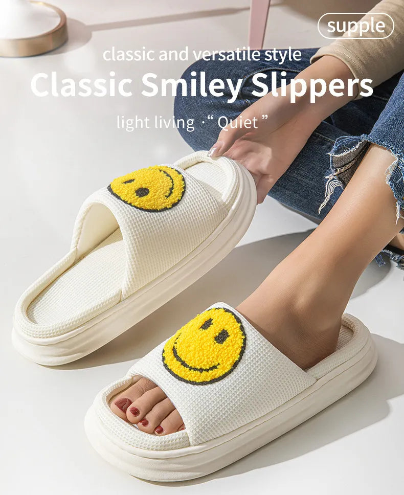 White slippers with smiley face design worn by a person on a light background