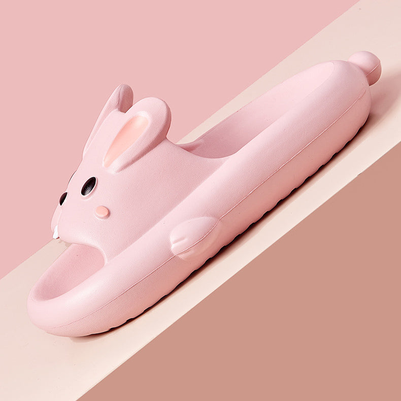 Pink rabbit-shaped slipper on a two-tone pink background