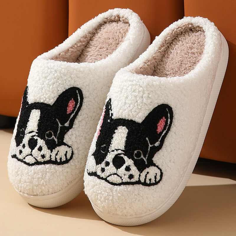 White slippers with black and white bulldog illustration on a beige background