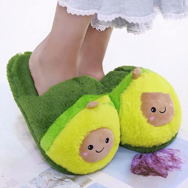 Avocado-themed slippers with faces on a white background