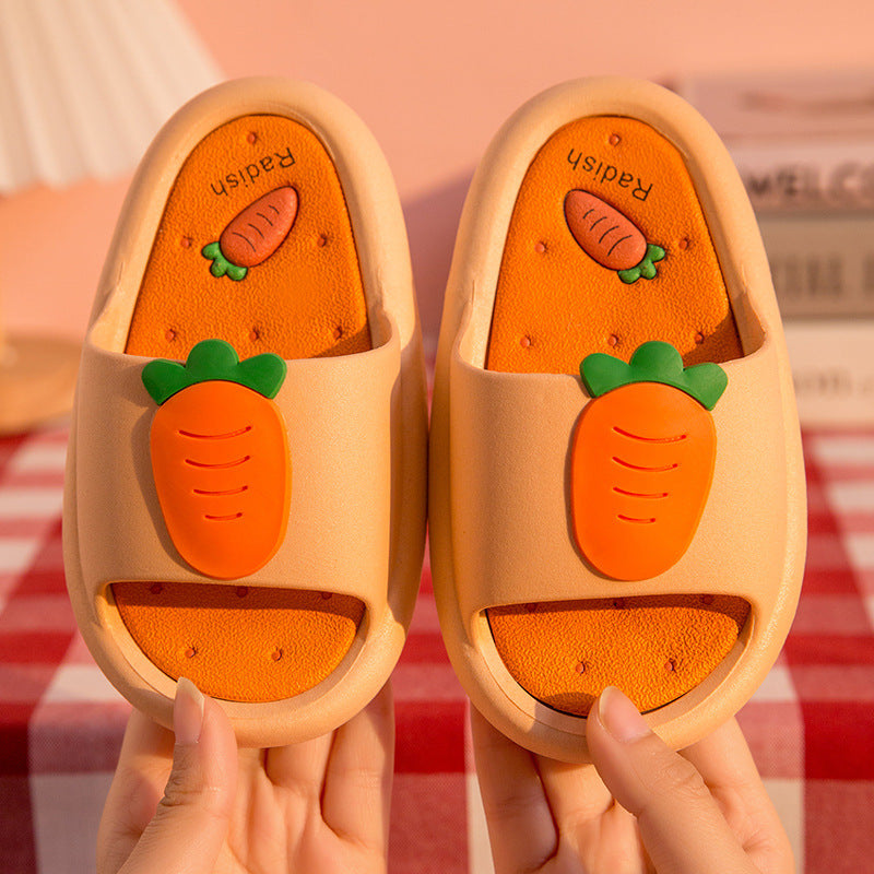Avocado-themed slippers held by a person against a striped background