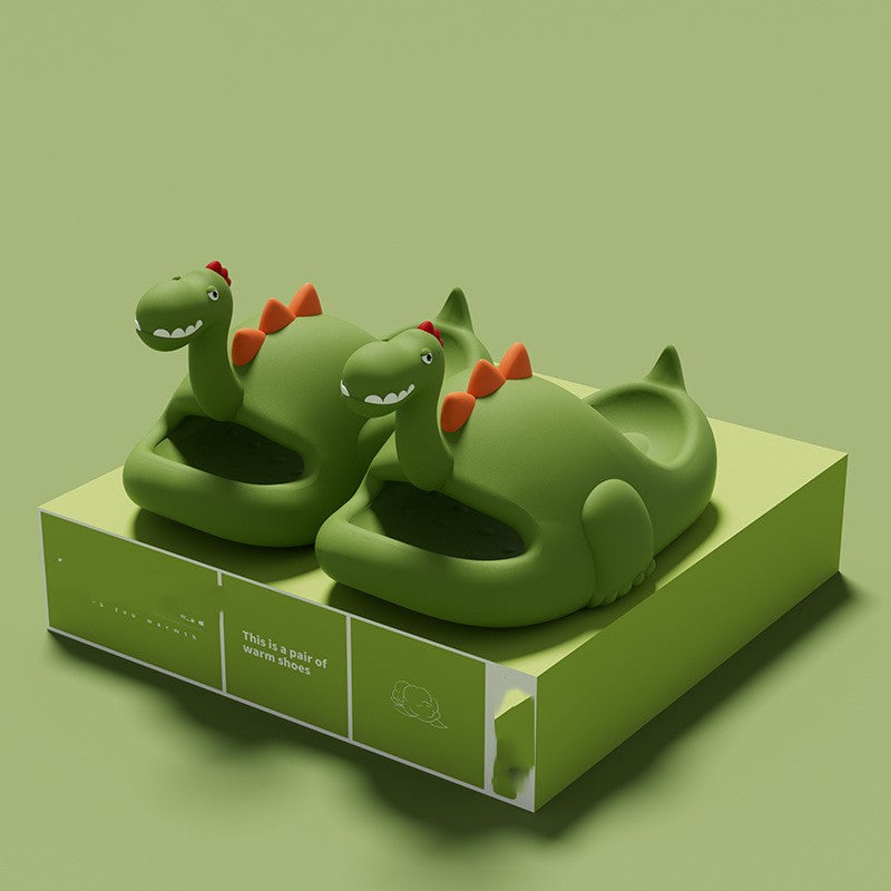 Green dinosaur-shaped slippers on a green platform with a green background