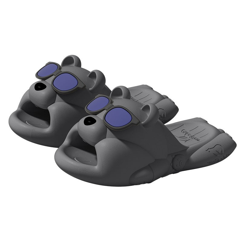 Gray animal slippers with blue straps on a white background