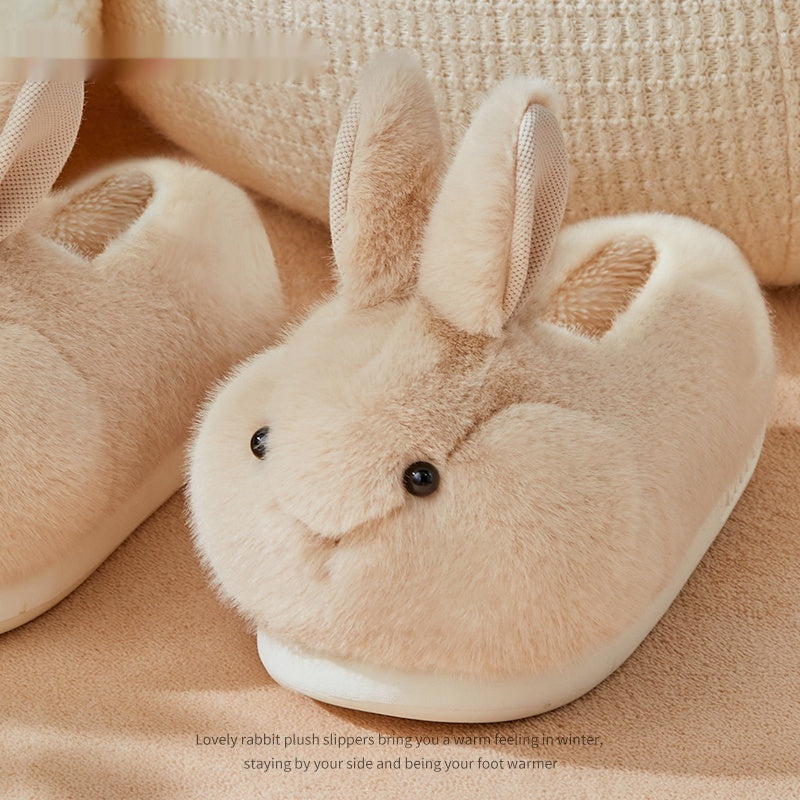 Beige plush rabbit slipper on a soft beige background