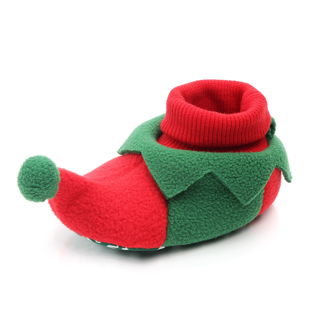 Red and green baby bootie with a white background