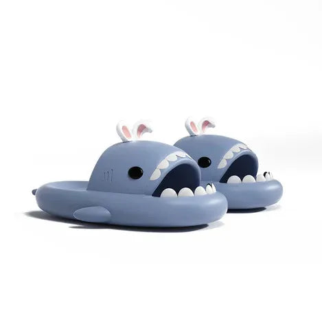 Pair of blue shark-shaped slides with bunny ears on a white background