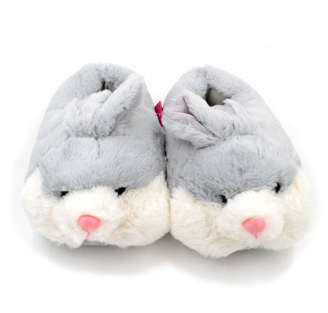 Pair of gray rabbit fluffy slippers with white soles on a white background