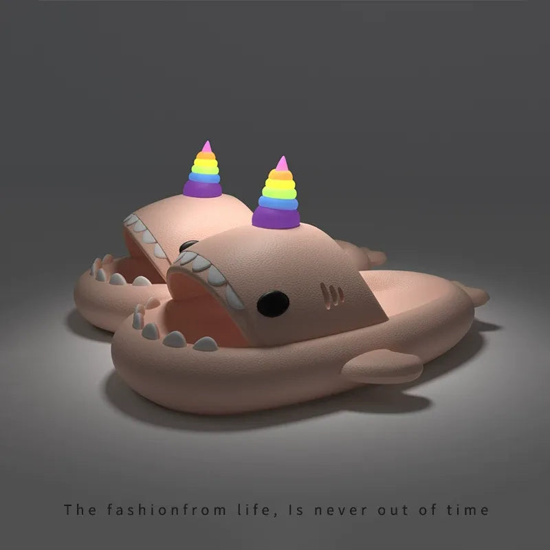 Toy shark with rainbow hats on a dark background