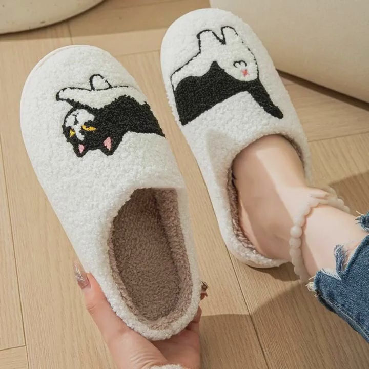 Slippers with cats on them. Cat with slippers theme