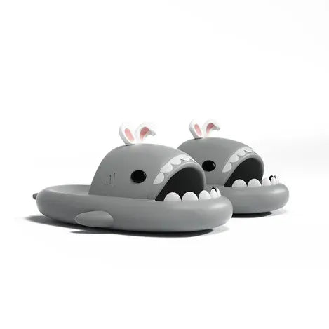 Gray shark-shaped slides with bunny ears on a white background