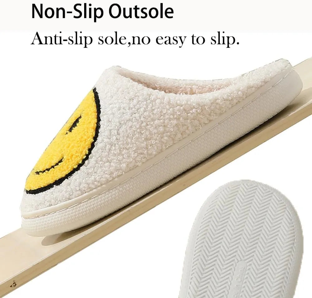 White slipper with a yellow smiley face design on a white background